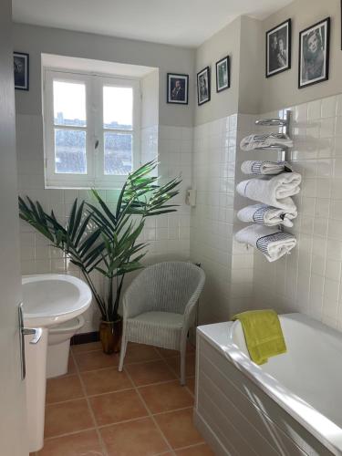 a bathroom with a tub and a toilet and a sink at 'Mulberry House' - A Darling Abode Nr Brantome in La Tour-Blanche