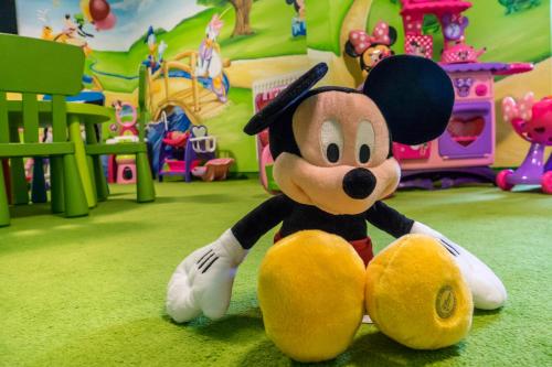 a mickey mouse toy sitting in a playground at Pensjonat Orlik Mountain Resort&SPA in Bukowina Tatrzańska