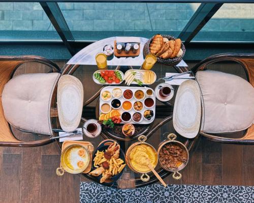 a table with a bunch of food on it at BİLİRİS HOTEL in Trabzon