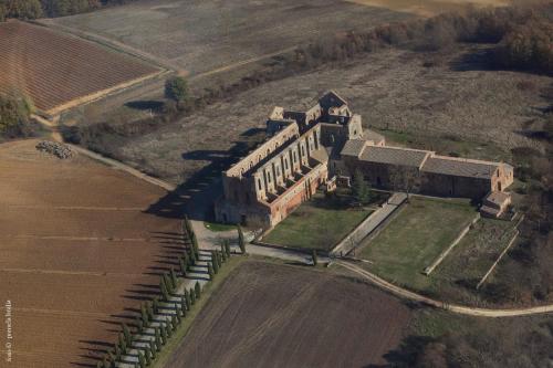 an aerial view of an old building in a field at Agriturismo San Galgano in Chiusdino