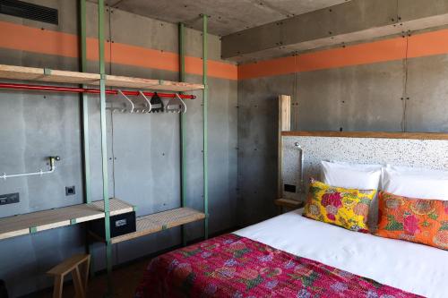 a bedroom with a bed and a bunk bed at JAM Lisbon in Lisbon