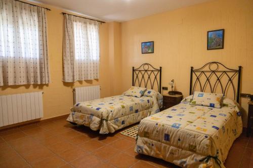 Ліжко або ліжка в номері Casa Rural La Carbonera