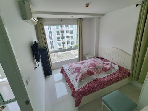 Ένα ή περισσότερα κρεβάτια σε δωμάτιο στο Energy Huahin Condo