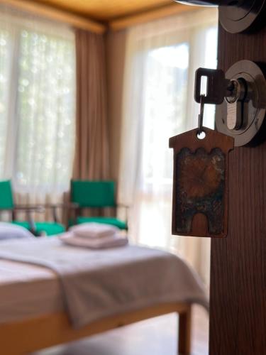 a hotel room with a bed and a picture on the wall at Bala's House in Mestia