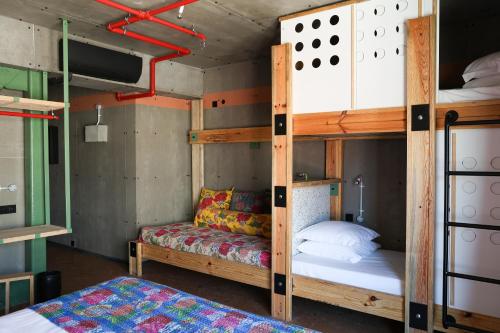 a room with two bunk beds and a bed at JAM Lisbon in Lisbon