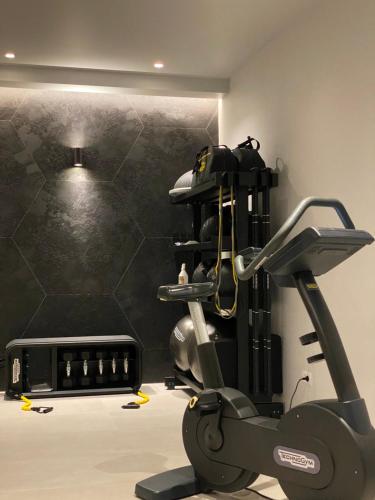 a room with a gym with a treadmill at Locanda Le Piazze in Castellina in Chianti