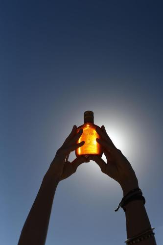 two people holding up a light in the sky at Constantinos the Great Beach Hotel in Protaras