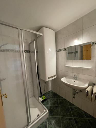 a bathroom with a shower and a sink at Ferienwohnung 121a - Top 2-3 in Königsleiten