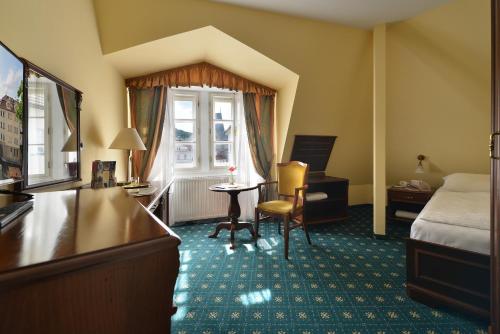 Postel nebo postele na pokoji v ubytování Hotel Certovka