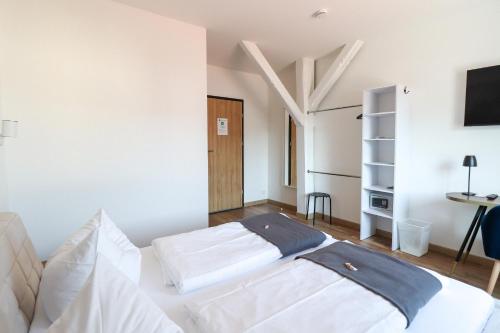 En eller flere senge i et værelse på Black Forest Hotel Kappel-Grafenhausen