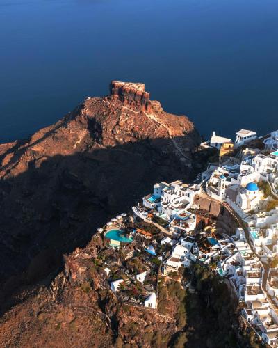 an aerial view of a village on a mountain at Eteoro Suites in Imerovigli