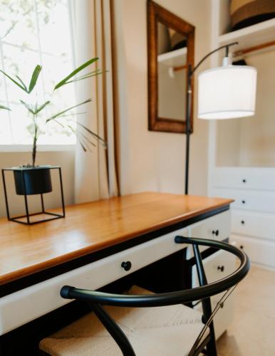a desk with a lamp and a chair at Wiona of Villa Paraiso / Beachfront Villa & Pool in Big Creek