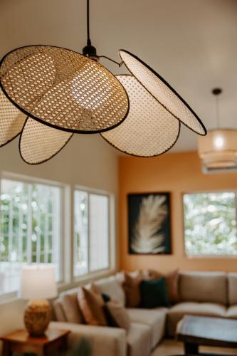 a living room with a couch and two lights at Wiona of Villa Paraiso / Beachfront Villa & Pool in Big Creek