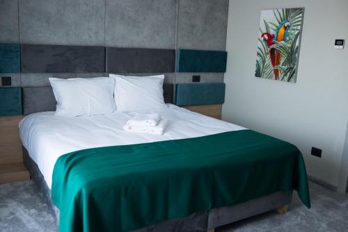 Postel nebo postele na pokoji v ubytování Hotel Plutitor Lebăda