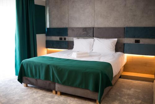 Postel nebo postele na pokoji v ubytování Hotel Plutitor Lebăda