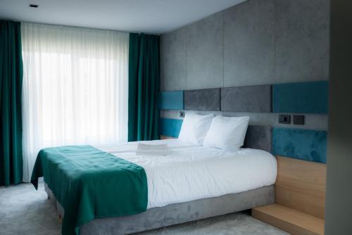 Postel nebo postele na pokoji v ubytování Hotel Plutitor Lebăda