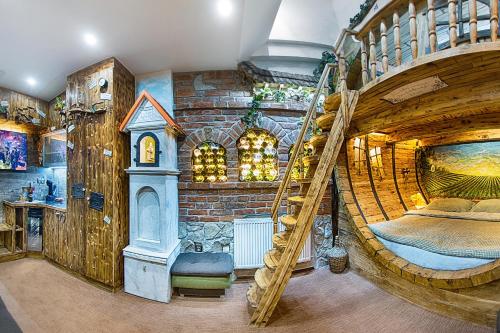 a large room with a large wooden bunk bed at Hotel Kocourkov in Hlinsko