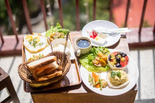 a table with two plates of food on it at Hotel Pala in Kathmandu