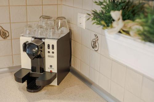 a coffee maker sitting on a counter in a kitchen at Tommy's Family Apartment in Katerini