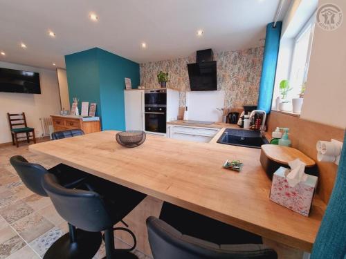 a kitchen with a large wooden table and chairs at Gîtes du Nord - L'Intemporel - 4 chambres in Chemy