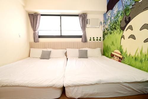 Una cama o camas en una habitación de Taichung FJ Victoria