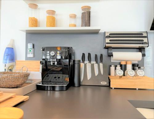 a kitchen with a coffee maker on a counter at Panorama Penthouse Apartment mit Klima und Whirlpool für bis zu 6 Personen in Frankenthal
