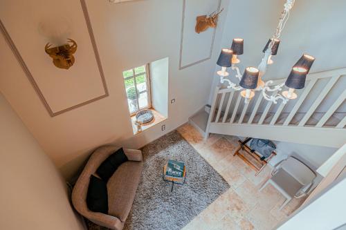 an overhead view of a room with a baby crib and staircase at Clos Marcamps - Teritoria in Prignac-et-Marcamps