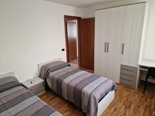 Postel nebo postele na pokoji v ubytování Appartamento LA CONCA, Alpago