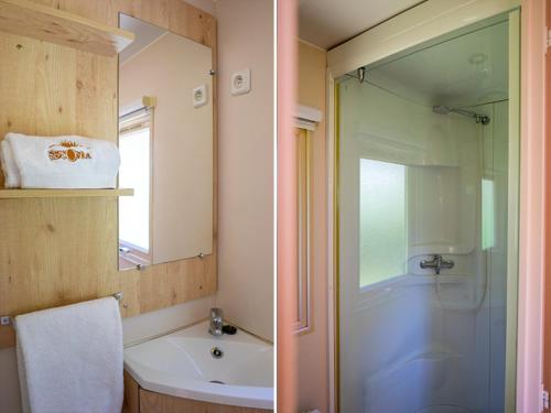 uma casa de banho com um chuveiro, um lavatório e um espelho. em Camping de la Forêt Seasonova em Sillé-le-Guillaume