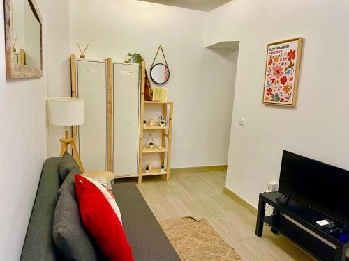 En TV eller et underholdningssystem på Stylish one bedroom flat in the heart of Madrid