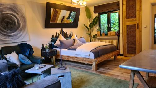 En eller flere senge i et værelse på Boutique Apartment Benz 1