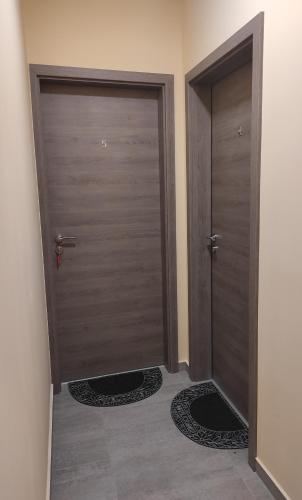 a pair of doors in a room with mats at Villa Grácia in Badacsonytomaj