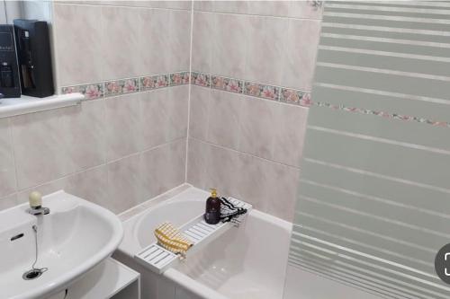 a bathroom with a shower and a sink and a tub at Entire Immaculate 3 Bedrooms House in Blackburn Weekend Away in Blackburn