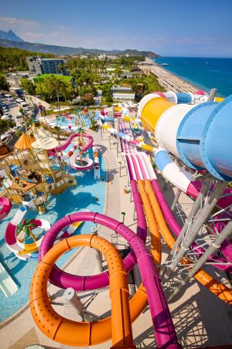 a water park with a bunch of slides and rides at Mövenpick Resort Antalya Tekirova - Ultra All Inclusive in Tekirova