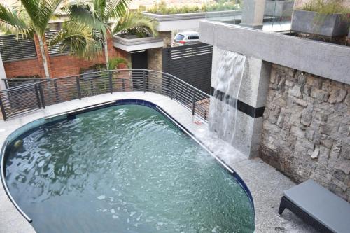 a swimming pool in the middle of a building at Supreme Villa in Kigali