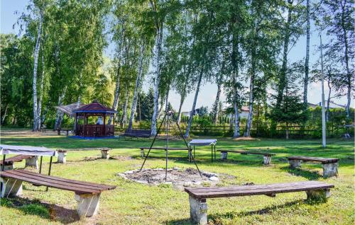 a park with picnic tables and a gazebo at Cozy Apartment In Ustka With Wifi in Ustka