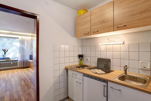 a kitchen with a sink and a counter top at Appartement Arend in Dobel