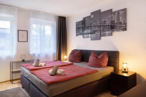 a bedroom with two stuffed animals sitting on a bed at Amselnest in Kempten