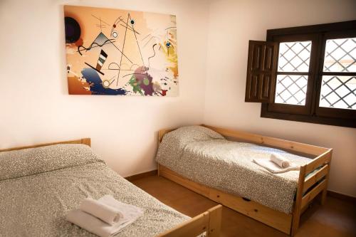 Postel nebo postele na pokoji v ubytování tuGuest Carataunas Apartment Alpujarra VI