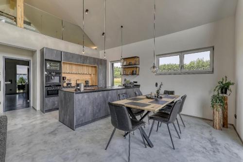 a large kitchen with a table and chairs in it at Chalet Panorama in Freyung