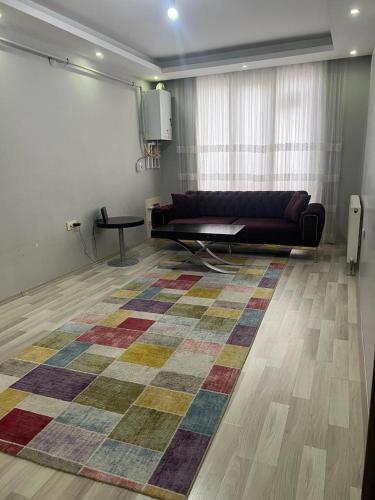 a living room with a couch and a rug at Comfort house Van in Van