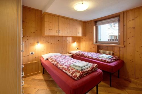 Postel nebo postele na pokoji v ubytování Appartamento Bormetti Paolo