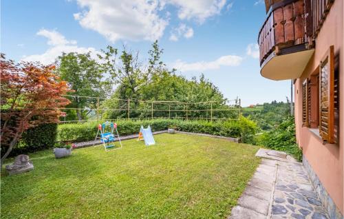 a garden with a playground in the yard of a house at Awesome Home In Dragovanscak With Sauna in Slavetić