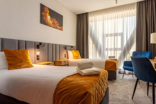Postel nebo postele na pokoji v ubytování Hotel Sante