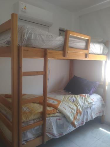 two bunk beds in a room with a bed at Rania Chalet -Stella Di Mare Sea view- Families in Ain Sokhna