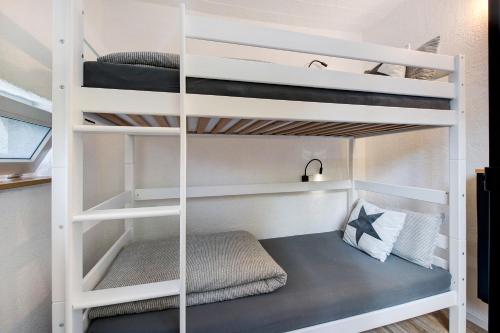 a bunk bed in a room with two bunk beds at Gutenburgturm 18qm auf 3 Etagen in Waldshut-Tiengen