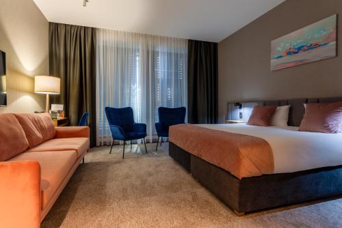 Postel nebo postele na pokoji v ubytování Hotel Sante