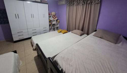 Cama ou camas em um quarto em Casa blanca Posadas