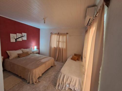 a small bedroom with a bed and a window at Casa Blanca Posadas in Posadas