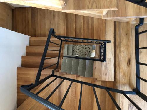 a spiral staircase in a room with wooden walls at b&b casa largo la piazzola in Vittorio Veneto